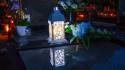 Colorful candles on the cemetery at All Saints Day