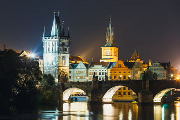 View of  Charles Bridge and Vltava river at night in Prague, Czech Republic