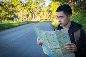 man travels with map