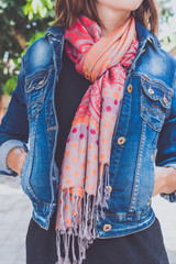 Fashionable young woman with cashmere scarf stand outdoor. Bali island.