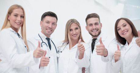 Portrait of doctors team showing thumbs up