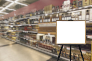 Alcohol department in the supermarket. Defocused image. Place for your text.