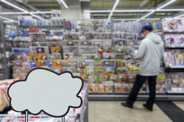 Store newspapers and magazines. Defocused image. Place for your text or advertisement.