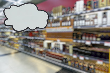 Alcohol department in the supermarket. Defocused image. Place for your text.