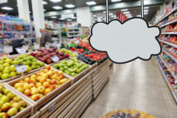 Supermarket, defocused image of the department of fruit. Place for your text.