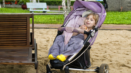 Child in a baby carriage.