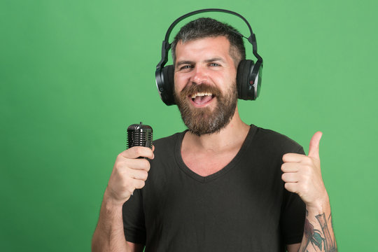 Pleasure, music and creative lifestyle concept. Dj with beard