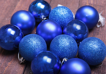 Blue christmas balls on a wooden background