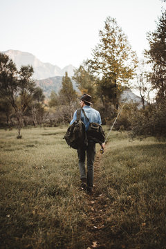 Man with backpack and rod
