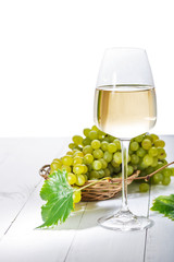Glass of white wine on vintage white  table