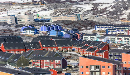 Greenlandic colorful houses standing on the rocky hills, Nuuk city, Greenland
