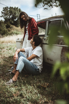 Young People Near Old Car