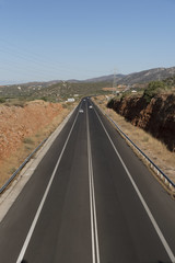 Malia, Crete, Greece. The E75 a National road with new road surface heading toward Agios Nikolaos.