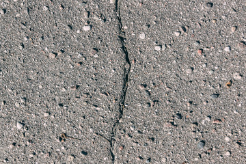 Crack on a gray stone asphalt