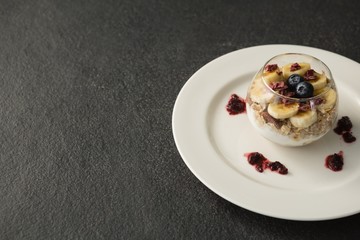 Fruit cereal in jar on concrete background
