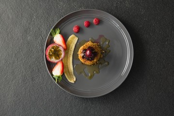 Healthy breakfast with fruits in a plate