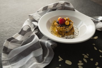 Plate of breakfast cereals with fruits