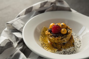 Plate of breakfast cereals with fruits