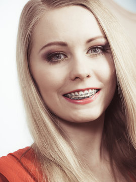Elegant woman showing her teeth with braces