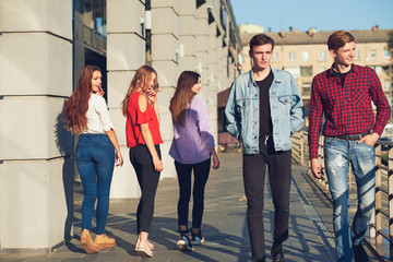 Group of young woman flirting with men in city. Friendship, leisure, student's lifestyle, first...