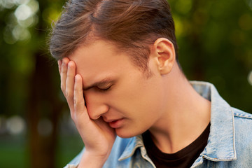 Fototapeta premium Men's stupid mistake. Regret guilt forget headache hangover concept