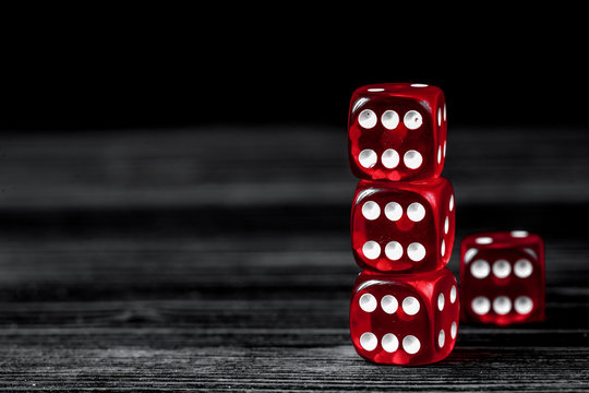 concept luck - dice gambling on dark wooden background