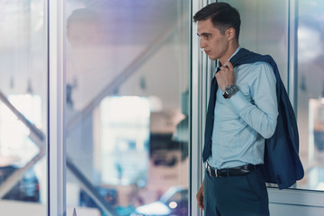 sad businessman/ Businessman looking through glass and thinking about work