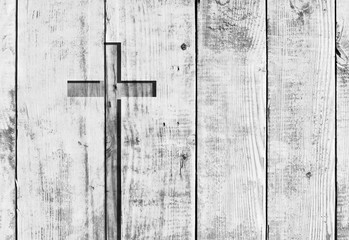 White old christian religion symbol cross shape as sign of belief on a grungy textured church wall or rustic aged background or backdrop, copy space for conceptual spirituality or resurrection design