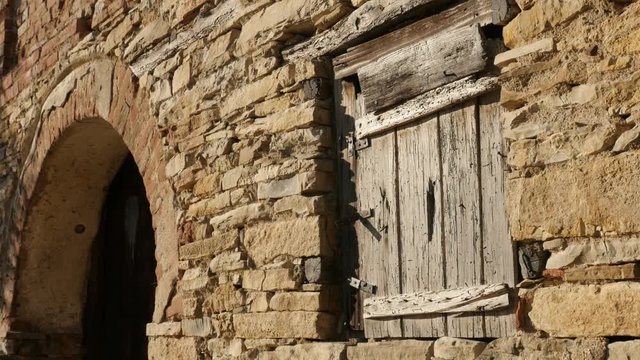 Ancient wine cellar wooden window and doors footage - Weathered stone building facade details