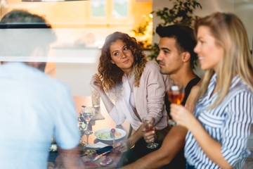 Enjoying at dinner with friends