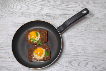 toasted scrambled eggs  cooking in a frying  pan.