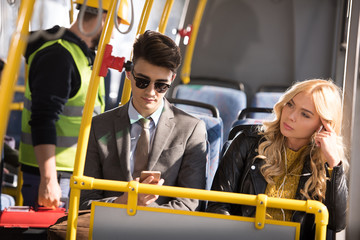 Fototapeta na wymiar couple with smartphone in bus