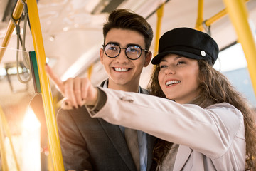 Obraz na płótnie Canvas smiling couple in bus