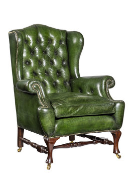 Antique Green Leather Wing Chair Carved Legs Isolated