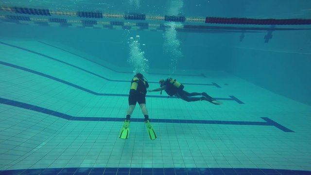 Training divers in the pool.