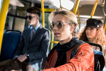 Fototapeta na wymiar young man in eyeglasses in bus