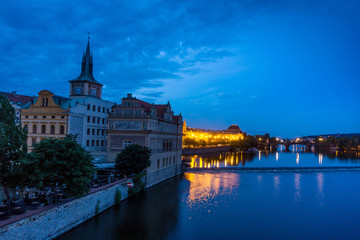 Fototapeta premium Old Town ancient architecture and river pier in Prague, Czech Republic