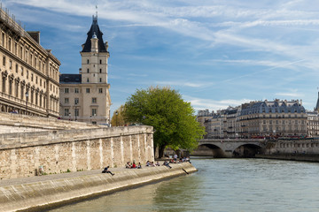 The picturesque embankments of the Seine in Paris, France. Buildings and trees
