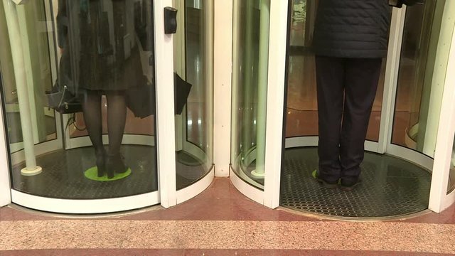 Employees pass through the entrance of the secret enterprise.The security system at the entrance .