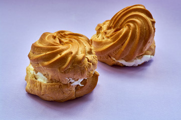 cake with cream over purple background