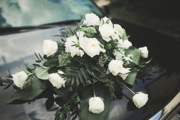 Wedding car decorated with beautiful, luxury flowers