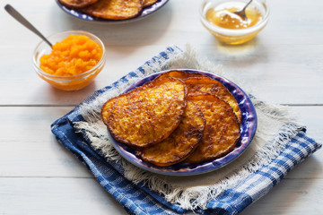 Pumpkin pancakes with honey and tea