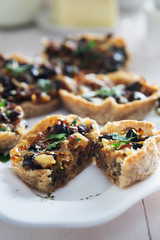 Snacks with mushrooms, olives and cheese