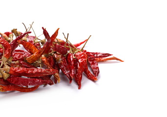 Dry red hot chili peppers, pile isolated on white background