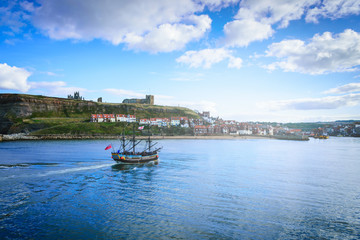 Classic boat on Whitby harbour in Whitby abbey, North Yorkshire, UK.