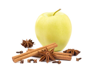 Aromatic apple, star anise, cloves and cinnamon isolated on white background