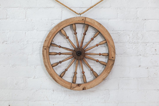 Steering wheel on a white brick wall background