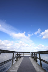 Obraz premium marine jetty pier with sea and beautiful sky