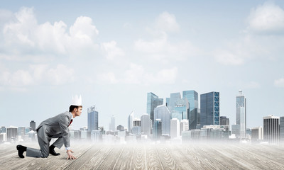 King businessman in elegant suit running and modern cityscape at background