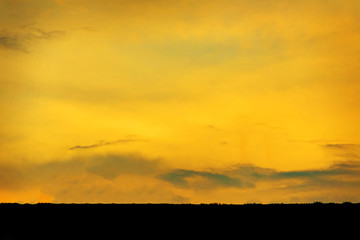Back view of a couple silhouette at colorful sunset on background